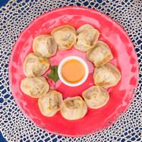 Chicken Momo · Steamed/fried. handmade dumplings filled with ground meat, cabbage, onion scallion, cilantro...