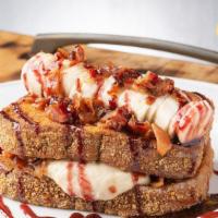 The Elvis Our Tribute To The King! · challah french toast with a graham cracker crust stuffed with creamy peanut butter, house-ma...