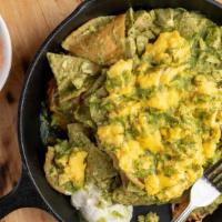 Chilaquiles · house made corn tortilla chips sautéed with our signature salsa verde & all-natural chicken ...