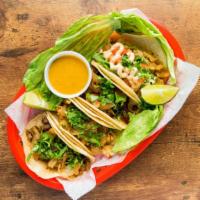 Tacos · Corn tortillas with your favorite meat, grilled onions, and cilantro.