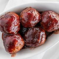 Bison Meatballs · Seasoned bison meat sautéed and served in our house made blueberry bourbon BBQ sauce.