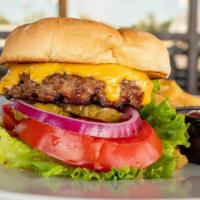 Okie Burger · American cheese, lettuce, tomato, pickles, and red onions.