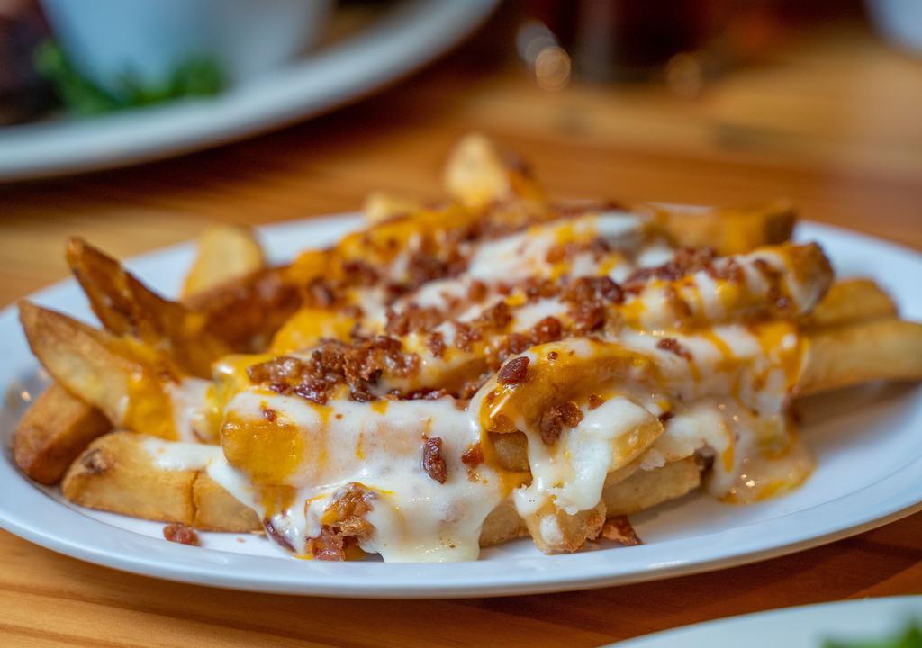 Pfred'S Preferred Pfries · Fries baked with lots of cheddar and mozzarella cheese and topped with bacon.