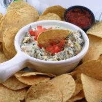 Spinach & Artichoke Dip · A creamy blend of chopped spinach, tender artichoke hearts, and Parmesan cheese. Topped with...