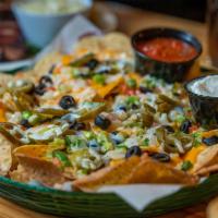 Loaded Lizard Nachos & Cheese · Nachos covered with cheddar, mozzarella cheese, tomatoes, onions, black olives, green pepper...
