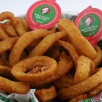 Beer Battered Onion Rings (Full Pound) · Vegetarian. One pound of beer battered onion rings served in a basket with ranch dressing.
