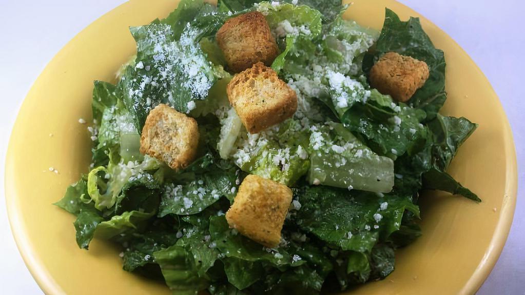 Caesar Salad-Small · Fresh romaine lettuce tossed with our Caesar dressing and topped with Parmesan cheese and croutons