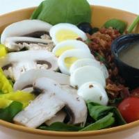Spinach Salad · A blend of spinach, chopped egg, bacon, sliced mushrooms, cherry tomatoes, black olives, and...