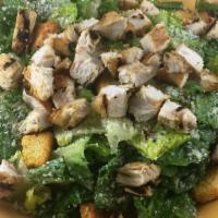 Chicken Caesar Salad · Fresh romaine lettuce tossed with our Caesar dressing and topped with Parmesan cheese and cr...