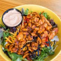 Mesa Chop Salad (No Meat) · A bed of greens  topped with black bean and fire roasted corn salsa, mozzarella cheese, ched...