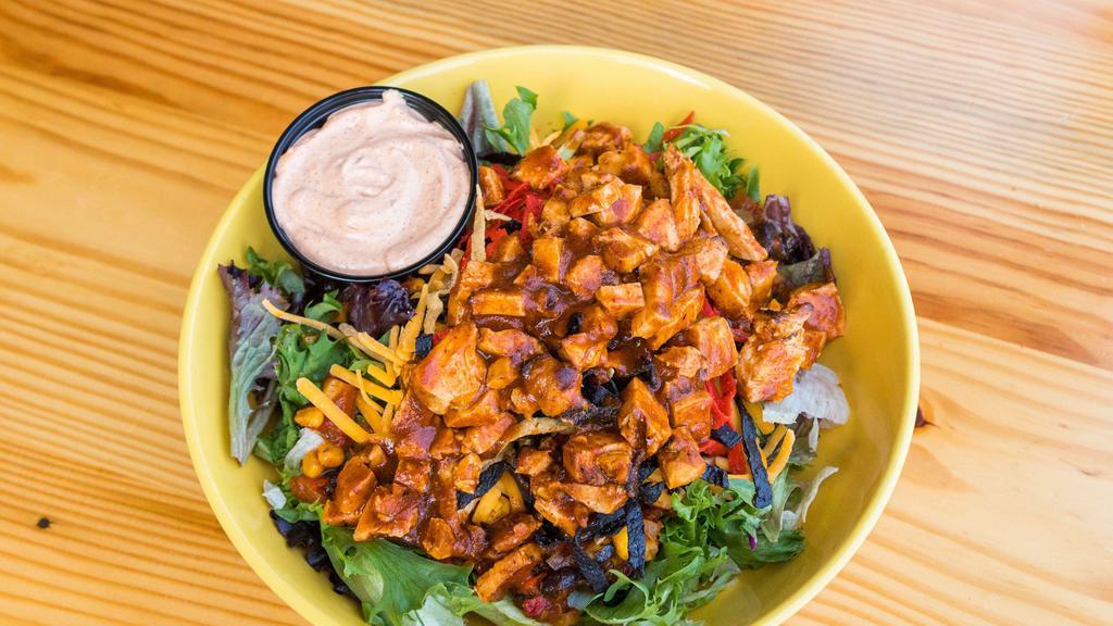 Mesa Chop Salad (No Meat) · A bed of greens  topped with black bean and fire roasted corn salsa, mozzarella cheese, cheddar cheese, and crispy tortilla strips. Served with a Southwestern ranch dressing.