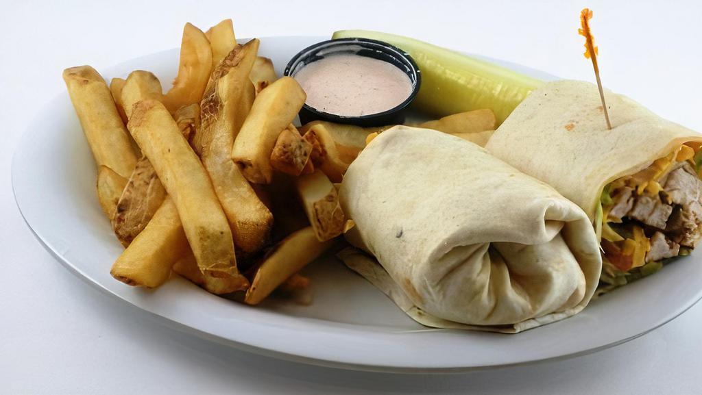 Cajun Chicken Wrap · Spicy. Cajun charbroiled chicken breast, lettuce, onion, green pepper, tomato, and cheddar cheese all rolled up in a warm flour tortilla shell with Southwestern ranch.