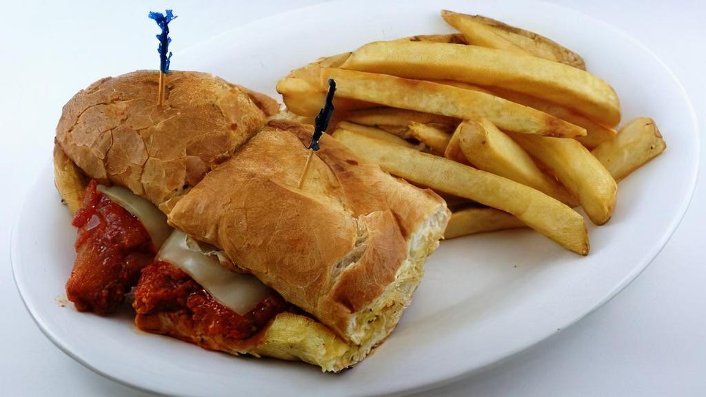Bo-Man'S Chicken Parmesan · Fresh chicken breast, lightly breaded with Italian bread crumbs, smothered in marinara sauce and melted mozzarella cheese. Served on garlic bread.