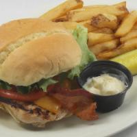 Cheddar Club · A grilled chicken breast topped with cheddar cheese, applewood bacon, lettuce, tomato and a ...