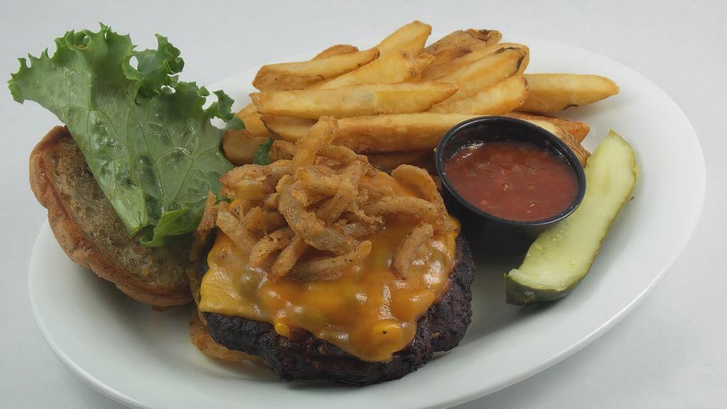 Black Bean Vegetable Burger · Spicy, vegetarian. A spicy blend of black beans, peppers, and Southwestern spices, served on a multi-grain hamburger roll with corn salsa, cheddar cheese, lettuce and a pile of crisp onion straws.