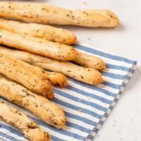 House Breadsticks · Freshly baked 16 piece breadstick made with butter, Italian seasoning and Romano cheese with...