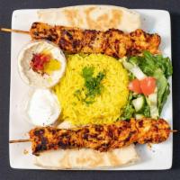 Chicken Kabab Dinner  · 3 skewers of char broiled marinated Chicken Kabab served with Basmati rice, Hummus, Salad, P...