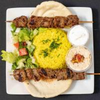 Beef Kabab Dinner · 3 Skewers of char broiled Beef Kabab served with Basmati rice, Hummus, Salad, Pita Bread & T...
