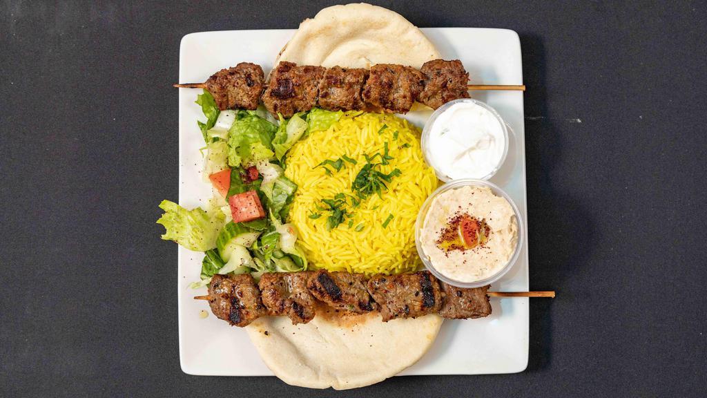 Beef Kabab Dinner · 3 Skewers of char broiled Beef Kabab served with Basmati rice, Hummus, Salad, Pita Bread & Tahini sauce on the side.