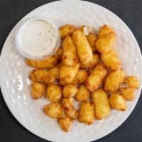 Cheese Curds · 6 oz of Heavenly battered and deep fried  White Cheddar Cheese bites.