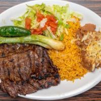Carne Asada (Steak) Sope · Contains beans, lettuce, tomato, cheese, onions and sour cream.