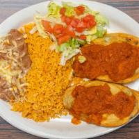 Chiles Relleno Dinner · 2 poblano peppers stuffed with cheese, served with rice and beans.