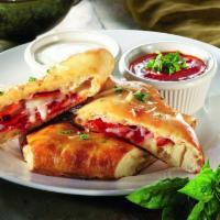 Pepperoni Bread · Hearth-baked dough stuffed with three cheeses and pepperoni, served with two dipping sauces.
