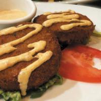 Crab Cakes · Traditional crab cakes loaded with tender crab meat, shrimp and spices, and pan-seared to pe...