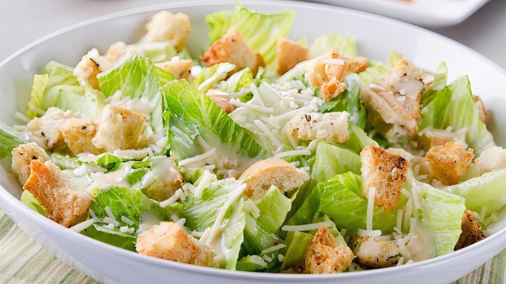 Caesar Salad · Romaine lettuce, asiago, Caesar dressing and Parmesan croutons.