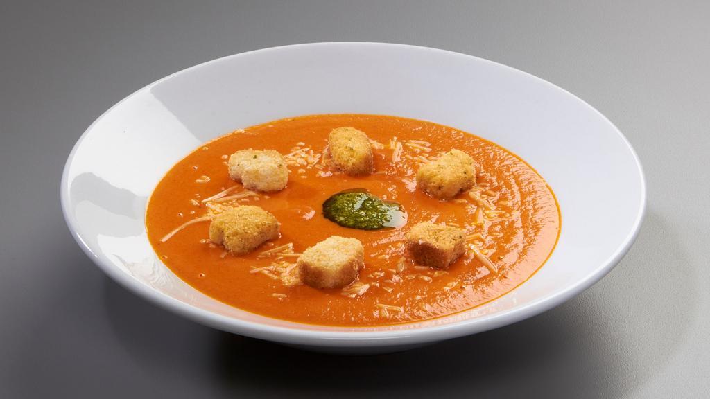 Tomato Basil Bisque · Finished with pesto, croutons and asiago.