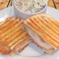 Spicy Chicken Formaggio Panini · Chicken, provolone, jalapeño bacon, baby spinach and chipotle mayo.