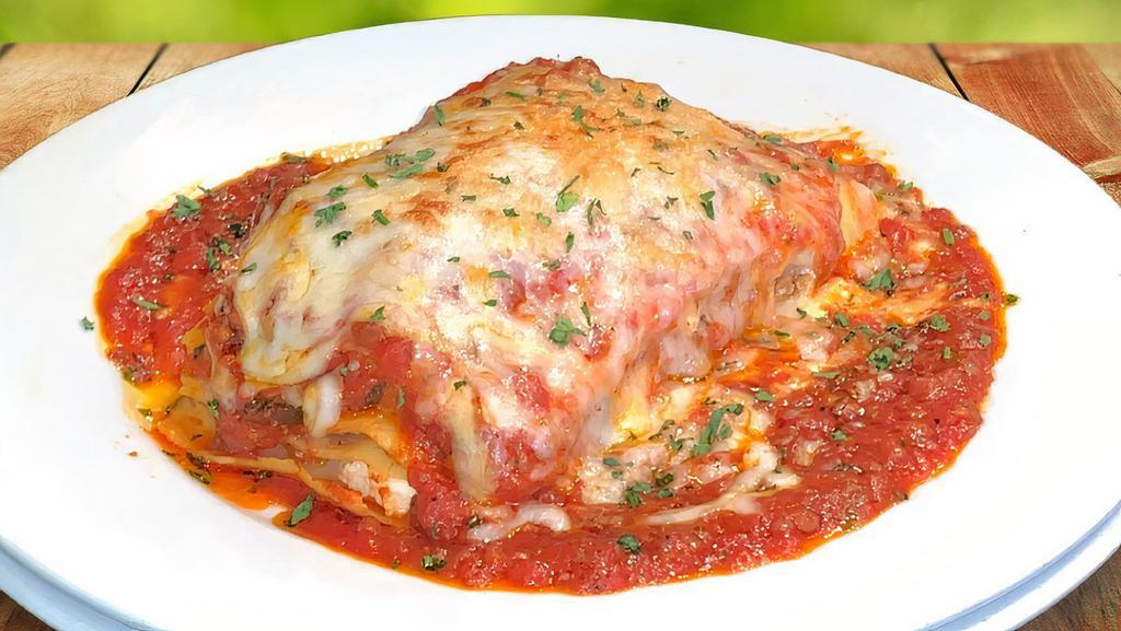 Lasagna · Beef, Italian sausage, ricotta, mozzarella, provolone and meat sauce.
