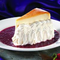 Cheesecake With Strawberry-Amaretto Coulis · Decadent traditional cheesecake made even better with an amaretto enhanced strawberry sauce ...