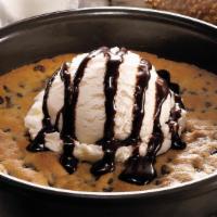 Deep Dish Cookie · Oversized, oven-baked chocolate chip cookie topped with premium vanilla ice cream and chocol...