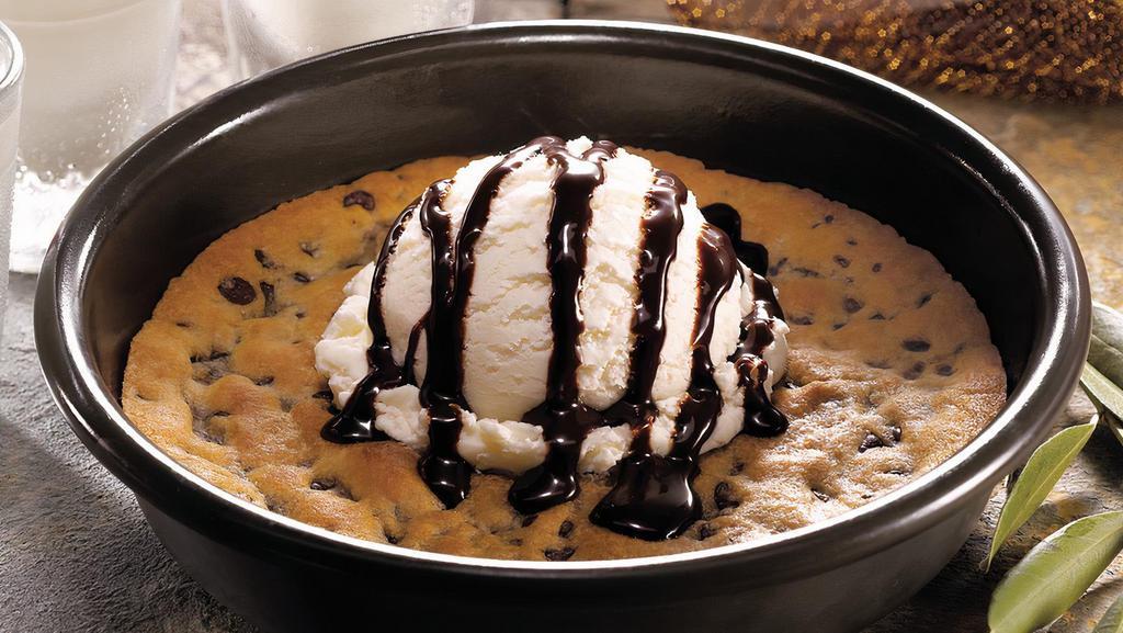 Deep Dish Cookie · Oversized, oven-baked chocolate chip cookie topped with premium vanilla ice cream and chocolate sauce.
