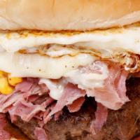  Corned Beef Burger · 8oz ground beef patty with Swiss & American Cheese topped with corned beef and a fried egg.