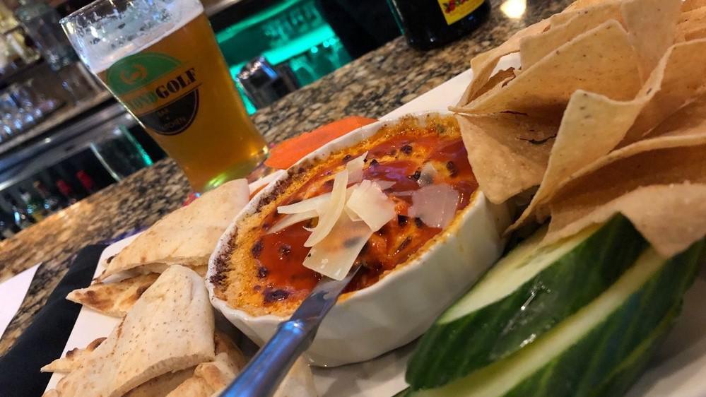 Buffalo Chicken Dip · Served with Carrots, Cucumber, Pita, Corn Chips