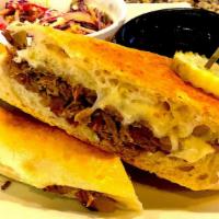 Beef Brisket French Dip · House Smoked Brisket, Provolone, Caramelized Onion, House Mayo, Served with Au Jus