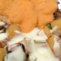 Puerco En Chipotle · Juicy pork loin covered with our delicious creamy chipotle sauce. Served with black beans an...
