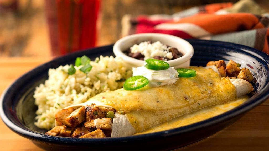 Chipotle Chicken Burrito · Grilled Fajita Chicken, sauteed green peppers & onions and cheese wrapped in a flour tortilla covered with Diablo sauce - a creamy sauce laced with the smoky flavor of chipotle peppers. Topped with sour cream and your choice of two sides. Mildly spicy.