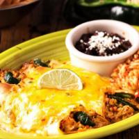 Enchiladas De Poblano · Two flour tortillas stuffed with Pulled Chicken and cheese and covered with Poblano Cream sa...