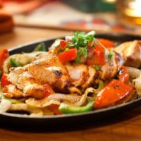 Chicken Fajitas · Grilled Chicken served sizzling with onions, green peppers, warm flour tortillas, cheese, le...