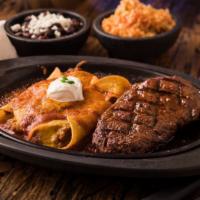 Steak & Enchiladas · A grilled 8-oz Sirloin Steak, lightly basted with the smoky flavor of chipotle peppers and s...