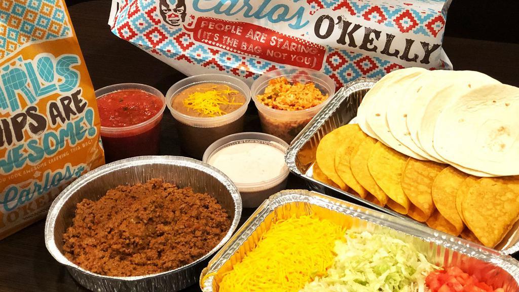 Carlos Taco Kit - Ground Beef · A favorite. Seasoned Ground Beef in soft flour tortillas or crispy corn shells (mix and match, 12 total), with cheese, sour cream, lettuce & tomatoes. Served with Fiesta Ranch Taco Sauce.