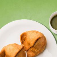 Splendid Samosa · Triangular pastry with a savory filling of spiced potatoes, peas, and lentils. Served with c...