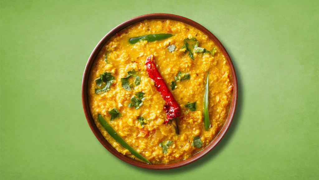 Sizzler Yellow Lentil · Loosened yellow lentils cooked with spices, tomato /spinach, green chili, cumin and onions.
