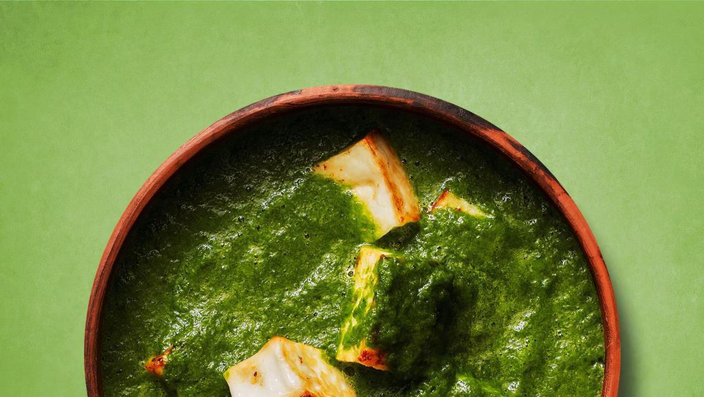 Spinach Veggie Paneer · Indian cottage cheese cooked with fresh spinach an Indian herbs and spices and cream.