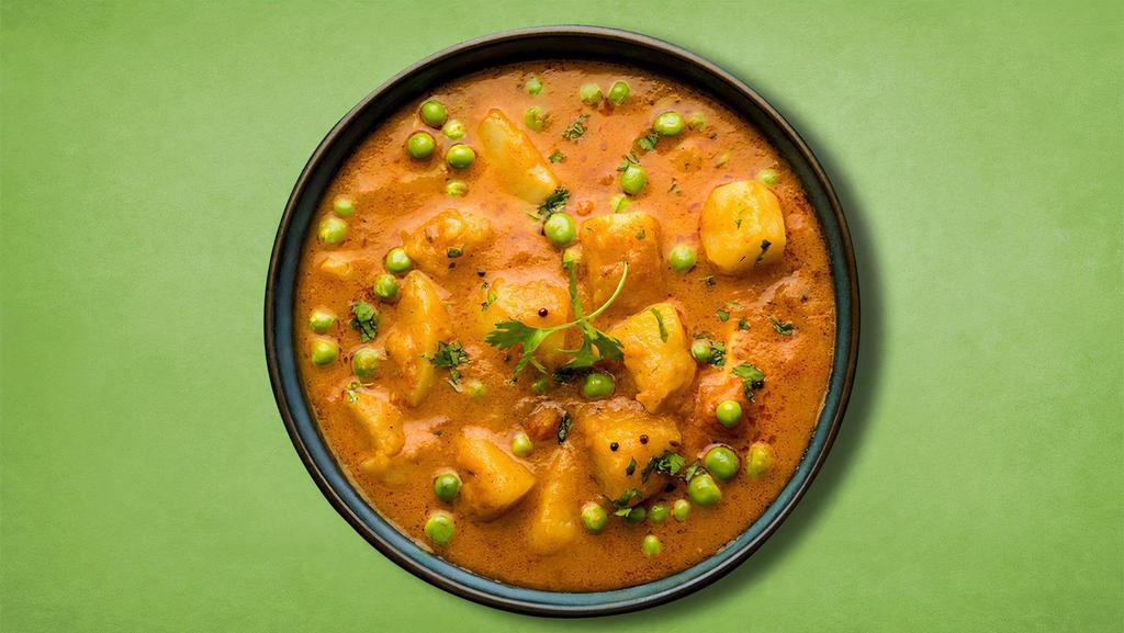 Perfect Potato Peas · Delicious Indian dish with potatoes and peas slowly cooked in Indian herbs and spices in a spiced tomato sauce.