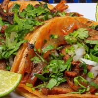 Al Pastor Taco · Marinated pork soaked with pineapple