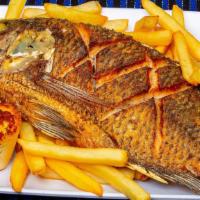 Fried  Whole Tilapia · Whole fried tilapia fish served with white rice, french fries, house salad, garlic bread and...